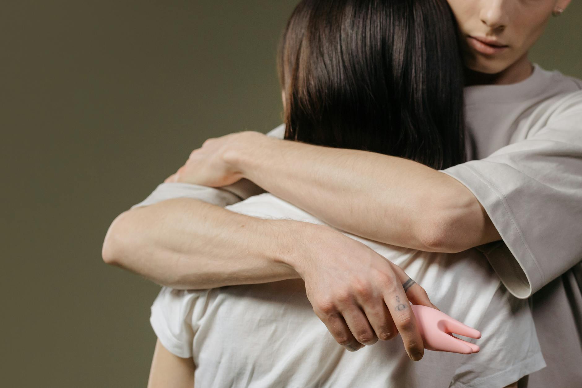 Close-up of a couple embracing, highlighting intimacy and connection during vulnerable moments.